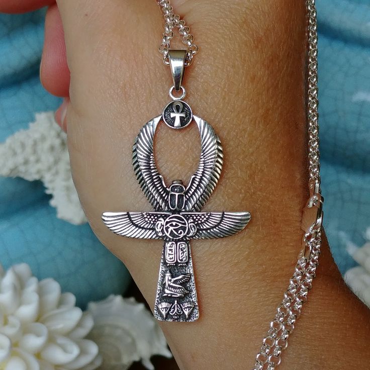 You will receive this exact ANKH pendant necklace   100% Solid .925 Sterling Silver   The Pendant is 2 1/4" Tall   Chain Length Options  This beautiful solid sterling silver Ankh pendant is incorporating many ancient symbols. It is light weight and calls on the power of the Egyptian Goddesses for protection. Meaning of ANKH Cross: The Ankh is one of the most recognizable symbols from ancient Egypt, known as "the key of life" or "cross of life" and dated to the Early Dynastic Period (c. 3150 - 26 Spiritual Ankh Jewelry For Jewelry Making, Handmade Symbolic Cross Pendant Necklace, Traditional Cross Pendant Necklace As Gift, Traditional Cross Pendant Necklace For Gift, Symbolic Etched Jewelry For Blessing, Symbolic Sterling Silver Necklace For Blessing, Symbolic Handmade Cross Pendant Necklace, Silver Jewelry With Large Pendant For Blessing, Traditional Ankh Necklace For Gifts