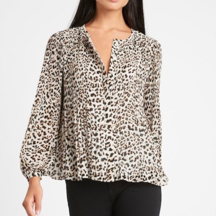 Soft, Sheer Georgette Lined Body. Unlined Sleeves. Delicate Pleats- Crisp Pleats At The Shoulders Create An Effortless Drape For This Flowing Top. Button Front. Crew Neck. Semi-Fitted. Long Sleeves. Cheetah Print Original Price $89.50 Trendy Leopard Print V-neck Blouse, Leopard Print Tops For Spring, Casual Long Sleeve Tiger Print Tops, Fall Tiger Print Tops, Trendy Long Sleeve Leopard Print Blouse, Trendy Long Sleeve Tiger Print Tops, Spring Leopard Print Relaxed Fit Top, Leopard Print Relaxed Fit Top For Spring, Chic Fall Tiger Print Tops