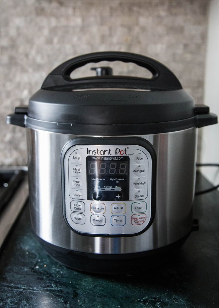 an electric pressure cooker on a white background