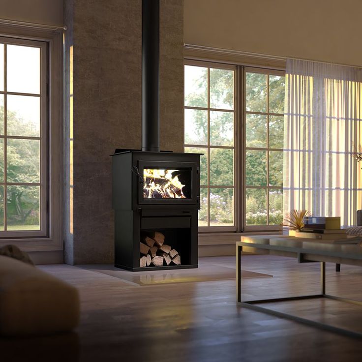 a living room filled with furniture and a fire place in the middle of it's walls