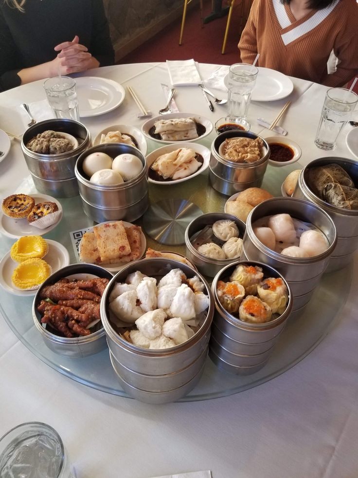 a round table with several tins of food on it