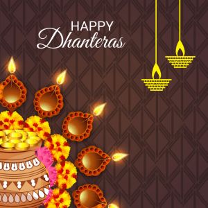 happy dhanteras greeting card with pot full of gold coins and lit candles on brown background