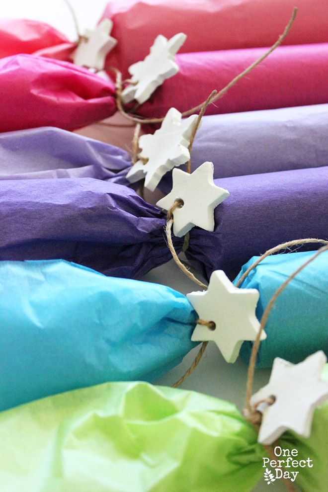 some paper stars are tied together with twine