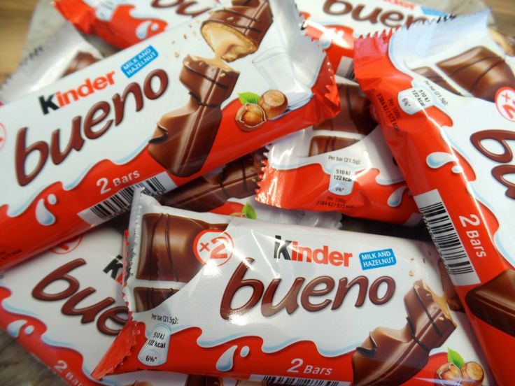 a pile of kinder chocolates sitting on top of a table next to each other