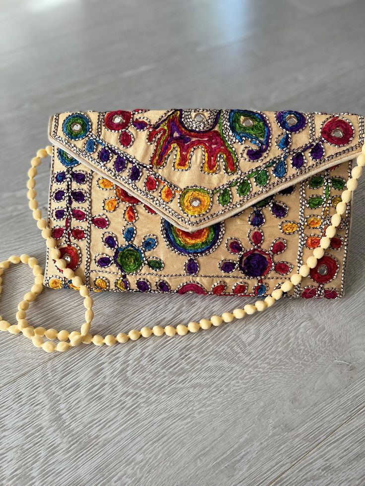 Indian handmade boho style handbag . hand embroidery all over . use as clutch bag or cross body . very lightweight Bohemian Handheld Beige Bag, Bohemian Beige Handheld Bag, Bohemian Beige Pouch Bag, Bohemian Rectangular Satchel For Summer, Bohemian Beige Satchel For Summer, Summer Bohemian Beige Satchel, Bohemian Rectangular Bag For Spring, Summer Pouch Bags, Bohemian Beige Bags For Spring