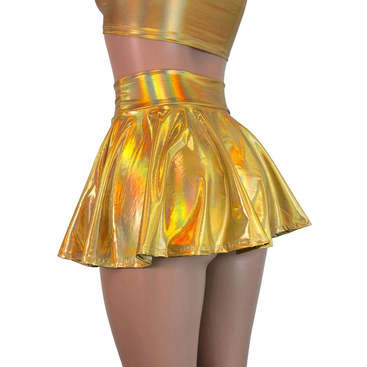 Stretch holographic gold opal spandex high-waisted skater skirt. The shimmery fabric shows a rainbow of colors in the light and swings and twirls with movement. The skirt length is 13" from top to bottom. Party Flared Skirt With Wide Waistband, High Waist Stretch Tennis Skirt For Party, Stretch Flared Tennis Skirt For Party, Metallic Stretch Skirt For Summer, Summer Metallic Stretch Skirt, Fitted Gold Skirt For Spring, Fitted Rave Skirt For Spring, Spring Rave Fitted Skirt, Metallic Stretch Mini Skirt For Summer