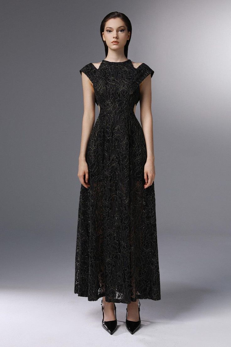 Crafted with intricate lace embroidery and a flattering A-line silhouette, this dress exudes elegance and luxury. The delicate cut-outs add a touch of sophistication, making it perfect for any special occasion. Elevate your style with this exclusive piece. Formal A-line Lace Maxi Dress, Evening A-line Dress With Lace Sleeves, Elegant A-line Lace Evening Dress, Elegant Lace Maxi Dress With Hollow Out Details, Elegant Maxi Length Hollow Out Dress, Elegant Hollow Out Maxi Dress, Elegant Black A-line Gown, Elegant Lace Patchwork Gala Dress, Elegant Lace Patchwork Dress For Gala