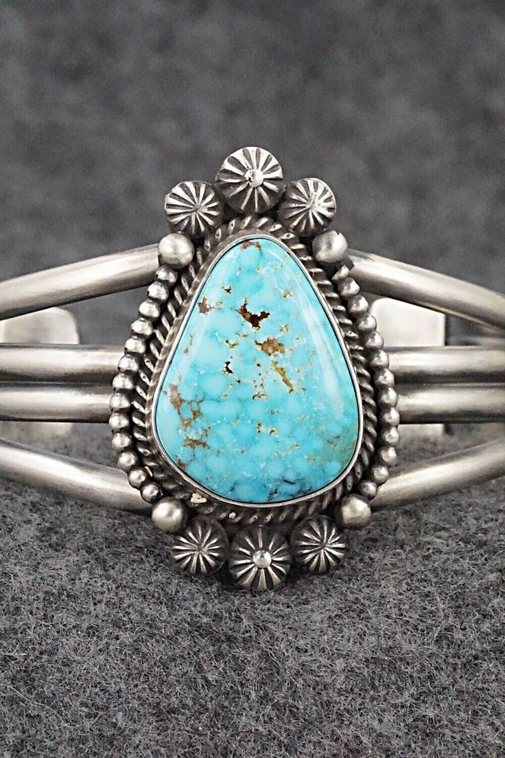 This natural Kingman turquoise and sterling silver bracelet was made by Navajo silversmith Michael Calladitto. The inside is signed MC and stamped Sterling.Size: 5 3/4" (will fit up to a 6 7/8" wrist)Gap: 1 1/8"Width: 1 3/4"Cuff Width: 5/8"Free shipping on all orders! We ship with USPS and always include tracking. All orders ship within a day of payment.Returns are accepted up to 30 days after you receive your order. Just send us a message. Our shop offers cash back or store credit. The item mus Silver Things, Camping Blanket, Kingman Turquoise, American Jewelry, Cuff Bangles, Sterling Silver Bracelet, Holiday Sales, Native American Jewelry, Turquoise Sterling Silver