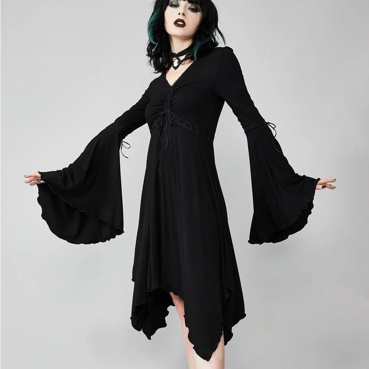 Whimsy Black Bell Sleeve Dress With Asymmetrical Hem. Black Dress Goth Dress Widow Dolls Kill Gothic V-neck Dress For Fall, Spring Gothic Stretch Dresses, Gothic V-neck Dresses For Spring, Gothic V-neck Dress For Night Out, Fitted Gothic V-neck Dress, Spring Gothic Midi Dress, Gothic Knee-length Mini Dress, Black Long Sleeve Gothic Midi Dress, Gothic Stretch Mini Length Dresses