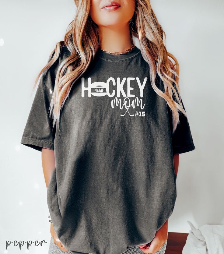 Custom Hockey Mom Shirt, Hockey Mama Tshirt, Sports Mom T-shirt, Gift Shirt For Sports Mom, Game Day Shirt, Mother's Day Shirt, Hockey Gift 👉 ABOUT Hockey Mom Comfort Colors® 1717 Shirt - 100% Airlume combed and ringspun cotton - Soft cotton and quality print make users fall in love with it over and over again. - These t-shirts have-ribbed knit collars to bolster shaping. - Printed and shipped from the USA CARE INSTRUCTIONS - Wash inside out with like colors. - Tumble dry or hang to dry. - Try Crew Neck Tops For Team Events During Sports Season, Crew Neck Top For Team Events And Sports Season, Sports Season Text Print Crew Neck T-shirt, Crew Neck Tops With Team Name For Team Events, Casual Letter Print Shirt For Team Events, Cotton Crew Neck Tops For Team Events, Casual Shirt With Letter Print For Team Events, Cotton T-shirt With Team Name For Sports Season, Graphic Print Cotton Shirt For Team Events