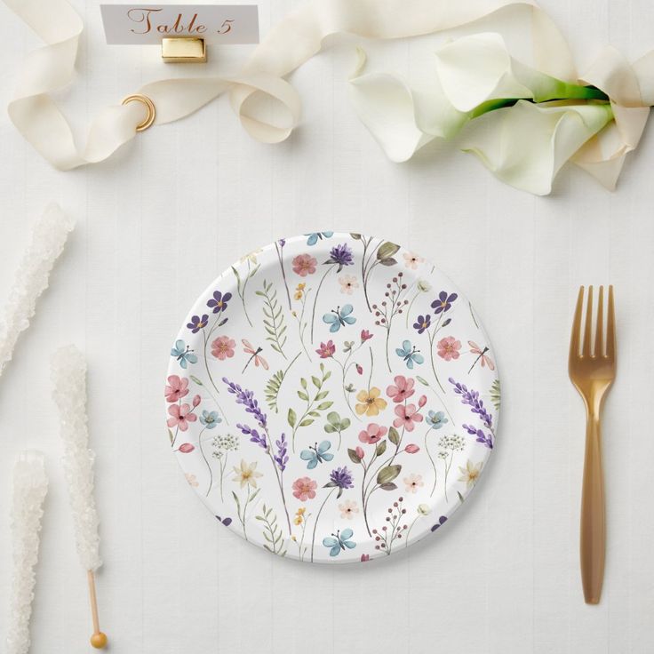 Elevate your bridal shower table setting with these elegant bridal shower plates. Perfect for serving sweet treats and desserts in style. Dainty and delicate, these plates will add a touch of sophistication to your celebration. #bridalshower #tablesetting #partyplates #weddingdecor #bridalshowerdecor #elegantplates #bridalparty #bride #bridalshowerideas #celebration Love Is In Bloom Bridal Shower Theme Table, Spring Bridal Shower Theme Ideas, Wildflower Bridal Shower Decor, Love Is In Full Bloom Bridal, Love Is In Bloom Bridal Shower Decor, Wild Flower Bridal Shower Ideas, Love Is Blooming Bridal Shower Theme, Love Is In Bloom Bridal Shower Theme, Wildflower Bridal Shower Theme