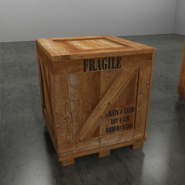 a wooden crate sitting on top of a floor next to another box with the word fragile written on it