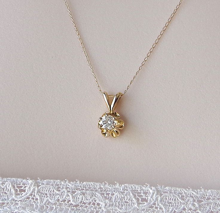 Diamond Solitaire Pendant 14K Gold Necklace Approx .23 cwt Vintage 1980s. Diamonds and Gold Pendant Graduation / Anniversary Gift Jewelry. Elegant Diamond and 14 k Gold Pendant in a Floral Design. Solitaire Diamond .23 ct. is (I1) clarity visible inclusions, color (I) almost white. Pendant measures 1/2 inch long by 1/4 inches wide. Diamond Total Carat Weight is approximately .23 cwt. Fine Anchor Link 14 kt Yellow Gold Necklace Chain 18 inches by .40 mm. For Quality Assurance I Always Chemically Vintage Round Diamond Necklace Gift, Antique Round Diamond Necklace For Wedding, Vintage Brilliant Cut Diamond White Necklaces, Vintage Diamond Necklace In Yellow Gold, Vintage Diamond White Necklace With Diamond Cut, Antique Diamond Necklace With 17 Jewels For Anniversary, Vintage Diamond Cut Necklace In Diamond White, Vintage Hallmarked Diamond Necklace, Vintage Yellow Gold Diamond Necklace