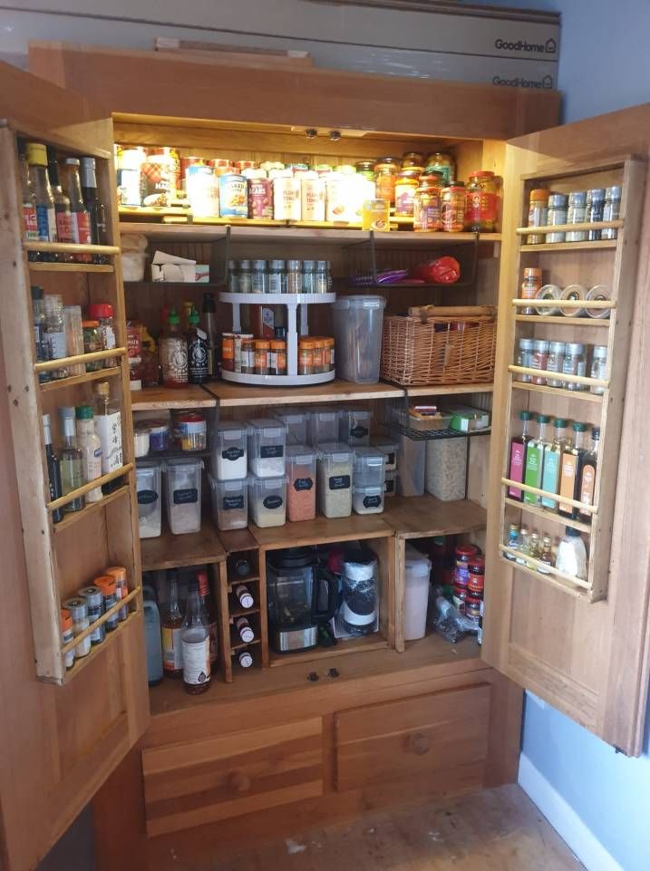 an open pantry with lots of food in it