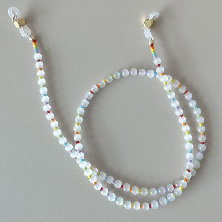 Who doesn't love a cheerful rainbow moment!? This 19" sunglass lanyard is comprised of milky white class beads and rainbow Japanese Miyuki beads! Miyuki Beads, Milky White, Love A, Jewelry Care, Shop Earrings, Lanyard, Beaded Earrings, Gift Card, Rainbow