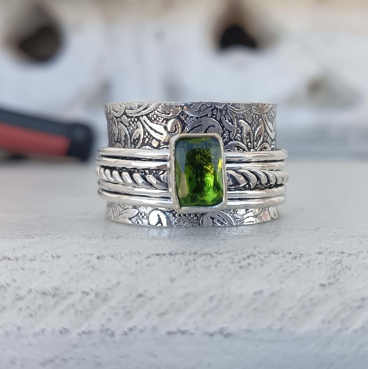 Welcome to my shop, Peridot 925 Sterling Silver Spinner Ring, Gift For Her ,Silver Spinner Ring, Wedding Ring. Metal : 925 Sterling Silver Gemstone : Peridot Stone Color : Green Stone Shape : Square Thanks for visiting. Adjustable Silver Emerald Open Ring, Silver Stackable Open Emerald Ring, Silver Stackable Emerald Open Ring, Stackable Silver Emerald Open Ring, Silver-colored Open Ring Emerald Birthstone, Silver Open Emerald Ring Birthstone, Handmade Silver Rings For May Birthstone, Adjustable Silver Emerald Ring With Birthstone, Silver Emerald Ring Adjustable Birthstone