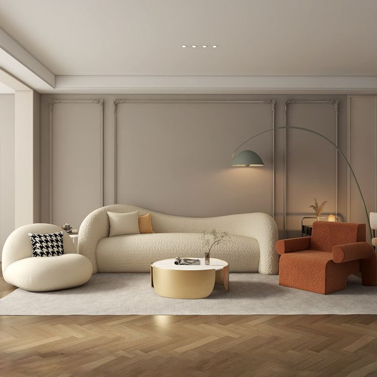 a living room filled with furniture next to a wall mounted lamp and wooden flooring