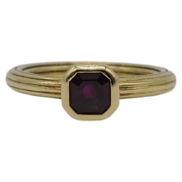 Immerse yourself in the captivating allure of this exquisite 18k yellow gold ring, a true statement of charm, beauty, and elegance. The centerpiece of this ring is an opulent, clear ruby that commands attention with its rich color and vivid presence. The ruby is expertly cut in a step-cut style, adding depth and brilliance to the overall design. This ring, with its seemingly simple yet striking design, is a true standout, showcasing the beautiful interplay of the deep red ruby against the vibrant yellow gold. It effortlessly captures the essence of charm and beauty, making it an absolute eye-catcher. To truly appreciate the condition and color nuances of this exceptional ring, I encourage you to explore the accompanying video. The video authentically captures the natural tones, ensuring a Gold Ring With Ruby, Ring Aesthetic, Ring With Ruby, Gold Vintage Ring, Aesthetic Movement, Step Cut, 18k Gold Ring, 18k Yellow Gold Ring, Red Ruby