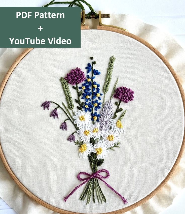 an embroidery pattern with flowers on it and the words youtube video written in front of it