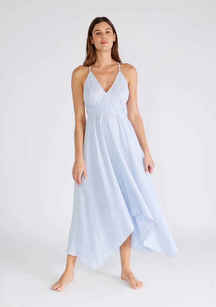 Freshen up your warm-weather wardrobe with our versatile halter neck beach dress in a breathable cotton gauze fabrication. This show-stopping style features a plunging v-neckline and a handkerchief hemline. The long straps can be tied in multiple ways, making it the most versatile dress in your closet. Airy cotton gauze Sleeveless Maxi length Handkerchief hemline V-neckline Halter neck Open back Cross back detail Long straps can be tied in multiple ways Model is 5'9, wearing a size S/M.Style: I- Breezy V-neck Maxi Dress For Brunch, Summer Flowy V-neck Halter Dress, Spring V-neck Sundress Halter Dress, Breezy V-neck Beach Dress For Daywear, Airy Flowy V-neck Dress, Chic V-neck Spaghetti Strap Beach Dress, Flowy V-neck Halter Dress With Tie Back, Chic Spaghetti Strap V-neck Beach Dress, Flowy V-neck Halter Dress For Beach