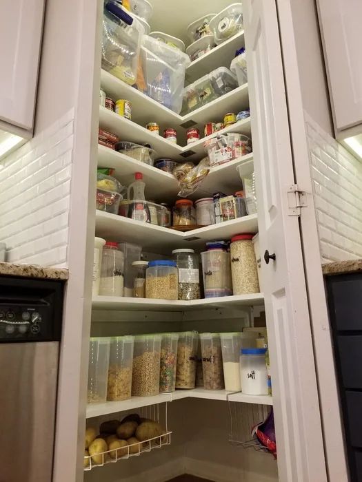 an open pantry with lots of food in it