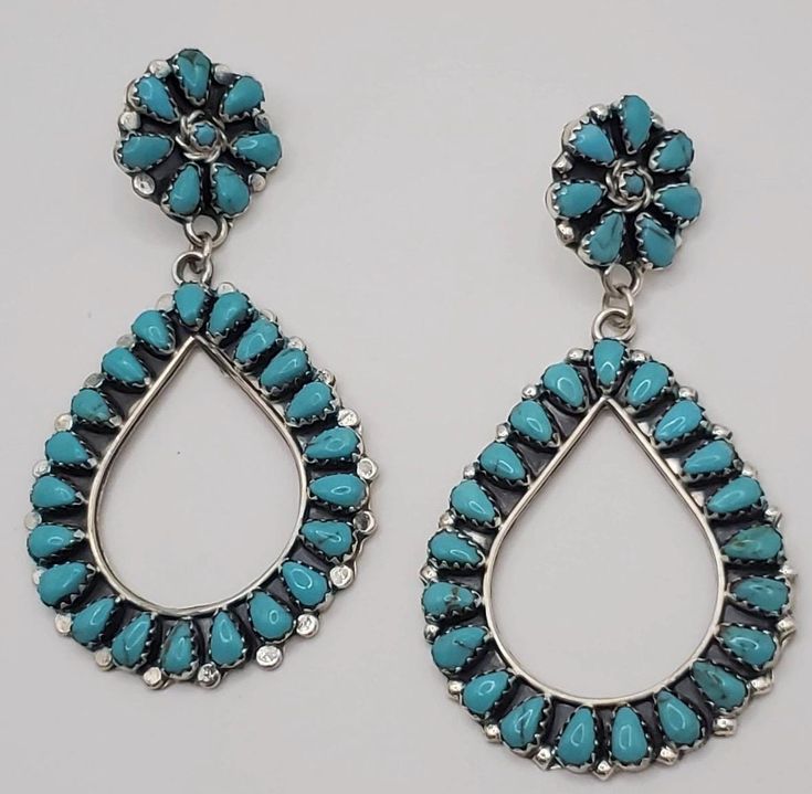 Gorgeous long turquoise pettitpoint earrings set in sterling silver.  These amazing earrings are large, stunning statement earrings.  These hoop style drop earrings are crafted in the petit point or needlepoint style and make a great addition to your wardrobe whether worn alone or paired with your favorite stud or dangle earrings. These gorgeous long earrings measure 3" in length and would make an impressive gift for daughter, gift for wife, gift for girlfriend or a beautiful self care gift for Teardrop Cluster Earrings For Jewelry Making, Handmade Teardrop Cluster Earrings, Turquoise Teardrop Chandelier Earrings, Turquoise Teardrop Chandelier Earrings In Sterling Silver, Stone Dangle Earrings, Multi Stone, Turquoise Earrings, Cluster Ring, Perfect Ring