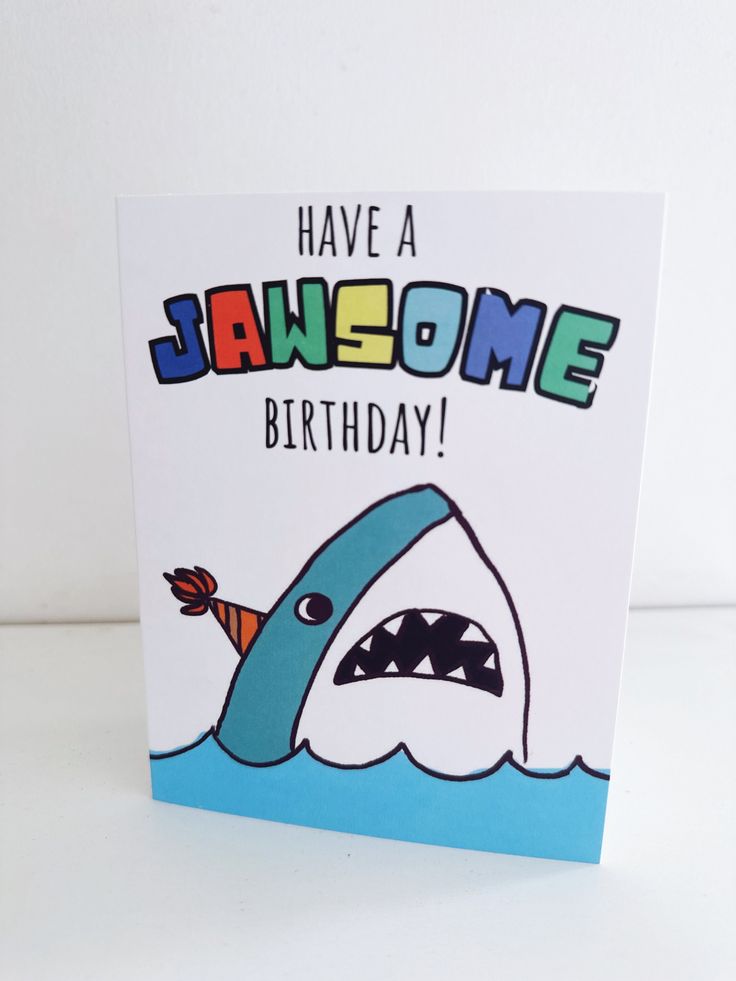 a birthday card with a cartoon shark on it