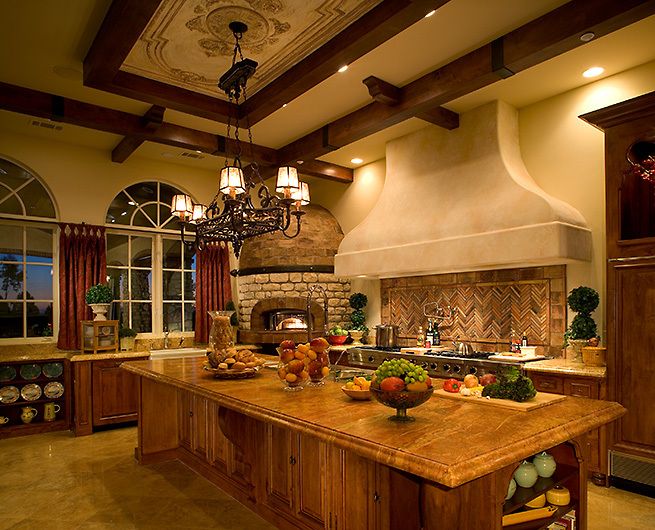 a large kitchen with an island in the middle