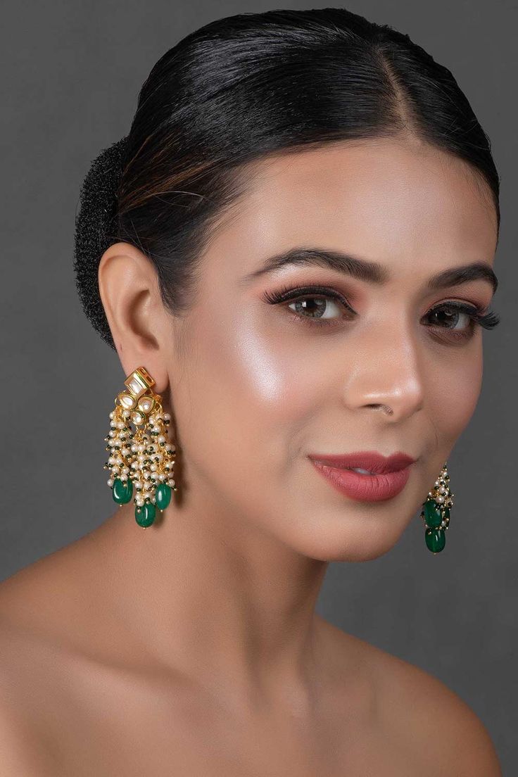 Gold toned kundan drop tassled emerald beaded earrings . This gold pair can be worn with any casual or formal dress for perfect party look. Product Features: Color: Green Material: Copper Alloy Work: Embellished with kundan & on back side meenakari comes Fastening: Bullet Clutch Wash Care: Spot-Cleaning only. Store in a separate box. Keep away from fragrance and water. Product Type: Earrings Disclaimer: There will be slight difference in digital to actual image Emerald Bead, Kundan Earrings, Green Pearls, Party Look, Beaded Tassels, Party Looks, Perfect Party, Gold Design, Pearl Beads