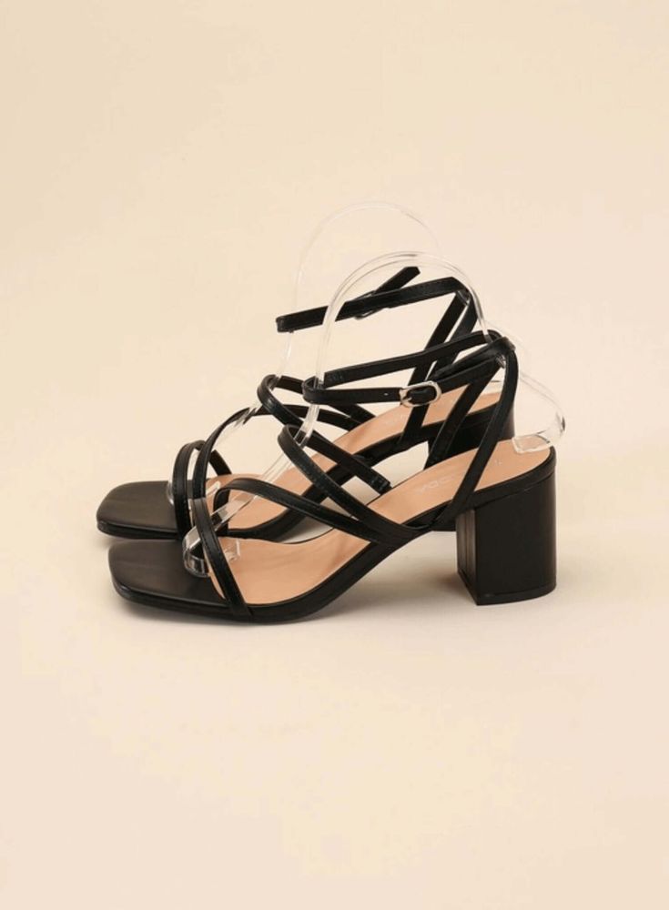 These low heels add a cool, modern edge to any outfit. With a square, open toe and a stylish block heel, these versatile sandals are a must-have for your summer wardrobe. The elegant strappy look will instantly elevate any look. Type: Sandals Pattern type: Solid Style: Chic Toe: Square, open toe Heel height: Mid heels Heel shape: Block heels Material: Synthetic Imported Sandals Patterns, Pork Pie Hat, Farm Clothes, Low Heel Sandals, Black Sandals Heels, Sleeveless Bodysuit, Silver Shoes, Green Shoes, Fall Shoes