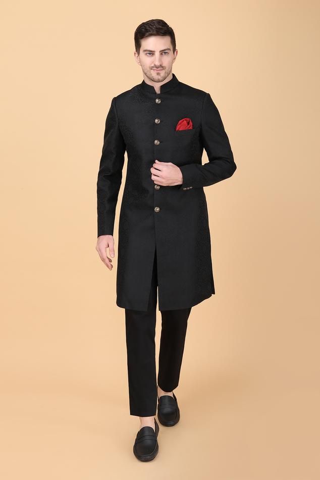 Black floral brocade pattern sherwani. Paired with pant. Comes along with a pocket square.
Components: 3
Pattern: Brocade
Type Of Work: Floral
Neckline: Stand Collar
Sleeve Type: Full Sleeves
Fabric:  Sherwani: Art Silk Brocade, Pant: Suitings
Color: Black
Other Details: 
Closure: Front buttons
Occasion: Destination Wedding,Groom - Aza Fashions Black Sherwani, Brocade Pattern, Rohit Bal, Silk Brocade, Manish, Full Sleeves, Wedding Groom, Pocket Square, Aza Fashion