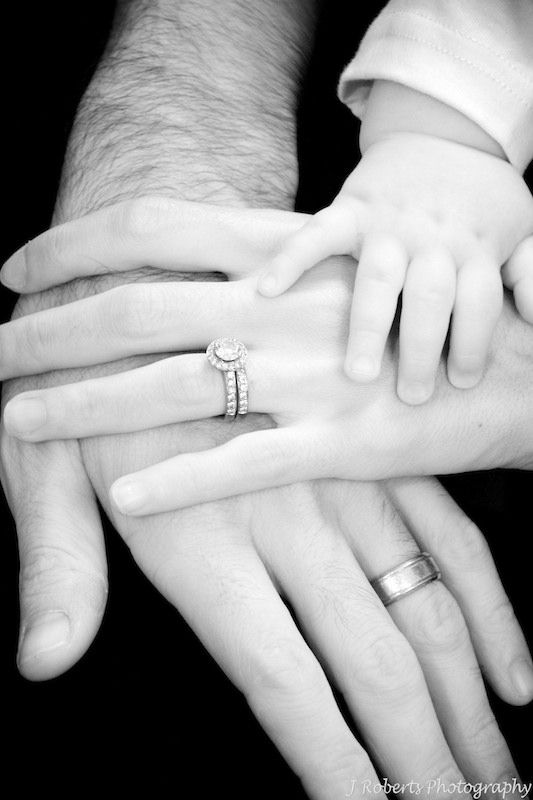 a group of people holding each other's hands with their wedding rings on them