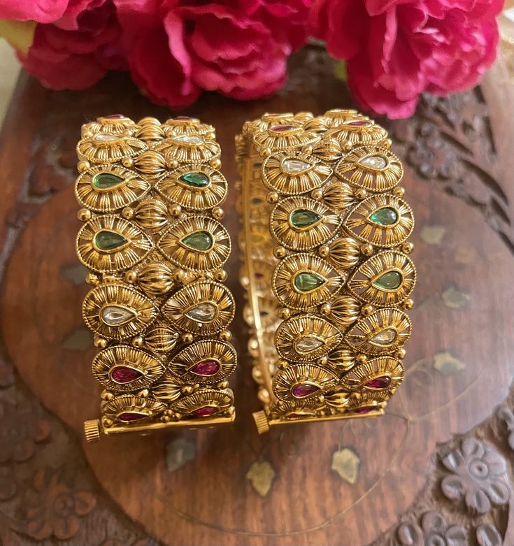 Elevate your traditional attire with our exquisite collection of Matt finish gold-plated Rajwada bangles. Each piece is a testament to craftsmanship, blending cultural richness with contemporary elegance. Our Indian jewelry ethnic kadas showcase timeless beauty, capturing the essence of tradition in every detail. Explore the allure of our temple jewelry-inspired bracelets, where heritage meets modernity. Embrace the legacy of fine craftsmanship with our traditional bangles, a celebration of Indian artistry that transcends time. Based on silver and copper alloy Highest quality and craftsmanship  You can pair these bangles with traditional banarsi sarees or lehengas. This will look great with zari silk sarees. We recommend you to wear this with pink or gold coloured saree. These bangles will Gold-plated Bangle Cuff Bracelet For Wedding, Traditional Gold-plated Openable Jewelry, Temple Jewelry For Festivals With Openable Feature, Festive Temple Jewelry With Openable Details, Festive Yellow Gold Tilla Bangle, Festive Openable Temple Jewelry, Temple Style Gold-plated Bangle For Festivals, Temple Style Gold Plated Bangle For Festivals, Gold Plated Temple Jewelry Bangle For Festivals