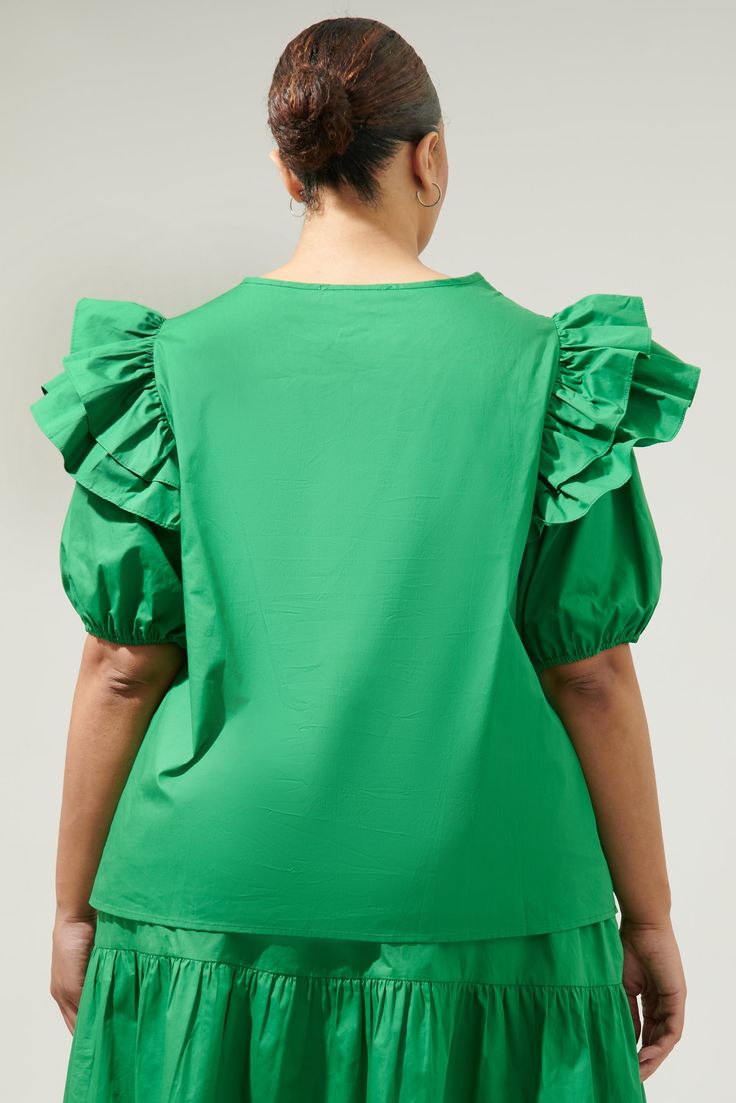 Keep it cute and classic in the Flores Poplin Ruffle Short Sleeve Top! Soft, cotton lightweight fabric, creates a keyhole neckline, and ruffle, puff half sleeves. Relaxed bodice features a poplin top to add details. Pair it with a please midi skirt for the ultimate summer look.- Puffed short sleeves- Keyhole- Ruffle detail- Cotton- Comes in 4 colorsSize + Fit - Model is 5'9" and wearing size 2X- Measurements taken from size 2X - Chest: 26 1/2"- Length: 29" Fabric Self: 100% Cotton Style Number S Solid Color Puff Sleeve Top With Gathered Sleeves, Puff Sleeve Top With Gathered Short Sleeves, Solid Puff Sleeve Top With Gathered Sleeves, Ruffled Puff Sleeve Top For Work, Ruffled Puff Sleeve Top For Workwear, Workwear Puff Sleeve Top With Ruffles, Summer Workwear Puff Sleeve Top With Ruffles, Poplin Top, Keyhole Neckline