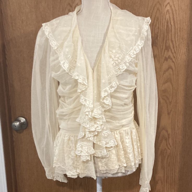 Just Beautiful. Brand New With Tags Attached. Purchased For A Wedding But Never Did Wear. 100% Cotton. Size 12-Measure 17 1/2 Inches From The Bottom Of The Arm Holds Across. Measures Approximately 25 Is At A Longest Point. It Is A Little Longer In The Front Than It Is In The Back. Classic Fitted Wedding Blouse, Vintage V-neck Blouse For Evening, Cream Long Sleeve Top For Wedding, Cream V-neck Blouse For Formal Occasions, Cream Long Sleeve Wedding Top, Ralph Lauren Fitted V-neck Top, Feminine Cream Tops For Wedding, Long Sleeve Cream Blouse For Wedding, Formal Silk Blouse With Lace Trim