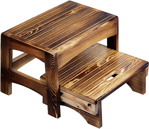 a wooden step stool sitting on top of a white background