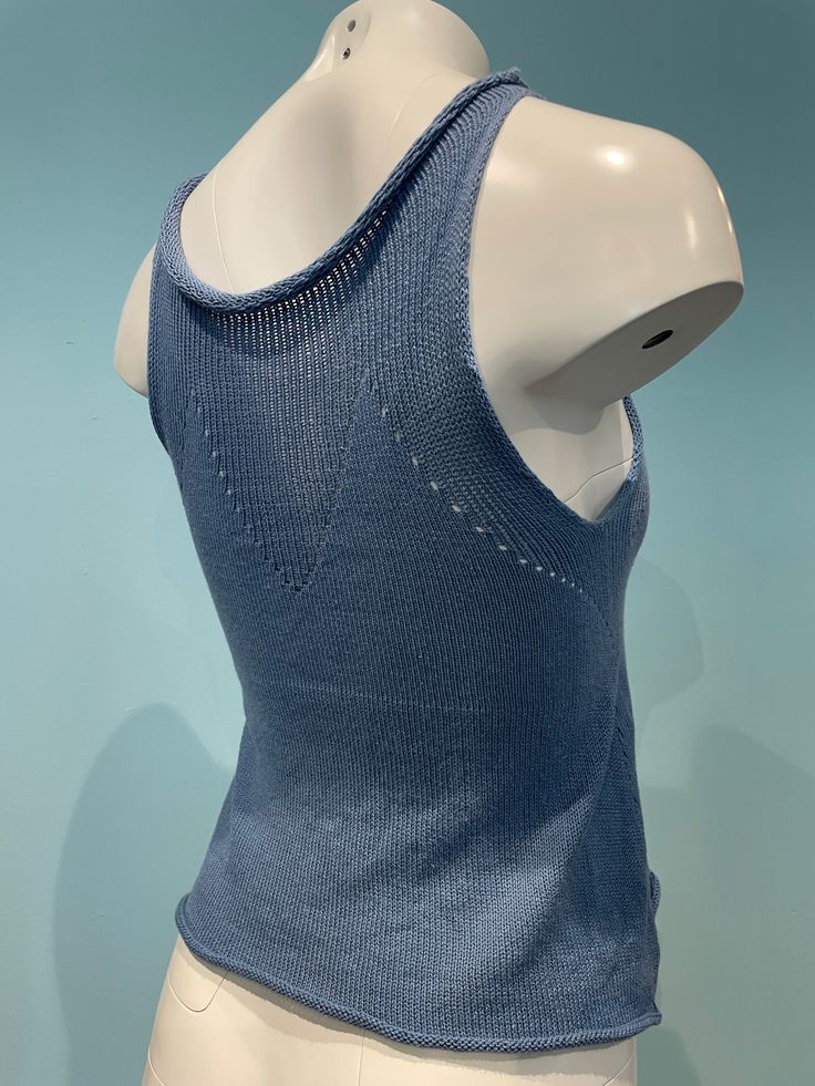 Soft periwinkle blue cotton tank top. One size fits most made in USA machine knit hand finished Fitted Seamless Blue Top, Casual Blue Knit Vest, Blue Knit Sleeveless Vest, Blue Knitted Sleeveless Vest, Light Blue Cotton Casual Camisole, Blue Knitted Sleeveless Sweater Vest, Light Blue Casual Cotton Camisole, Casual Light Blue Camisole Tank Top, Blue Cotton Sleeveless Sweater Vest