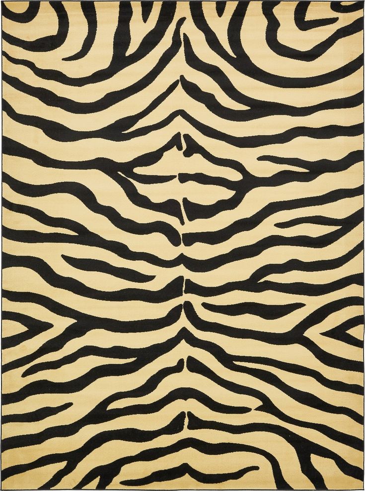 an animal print rug with black and white stripes