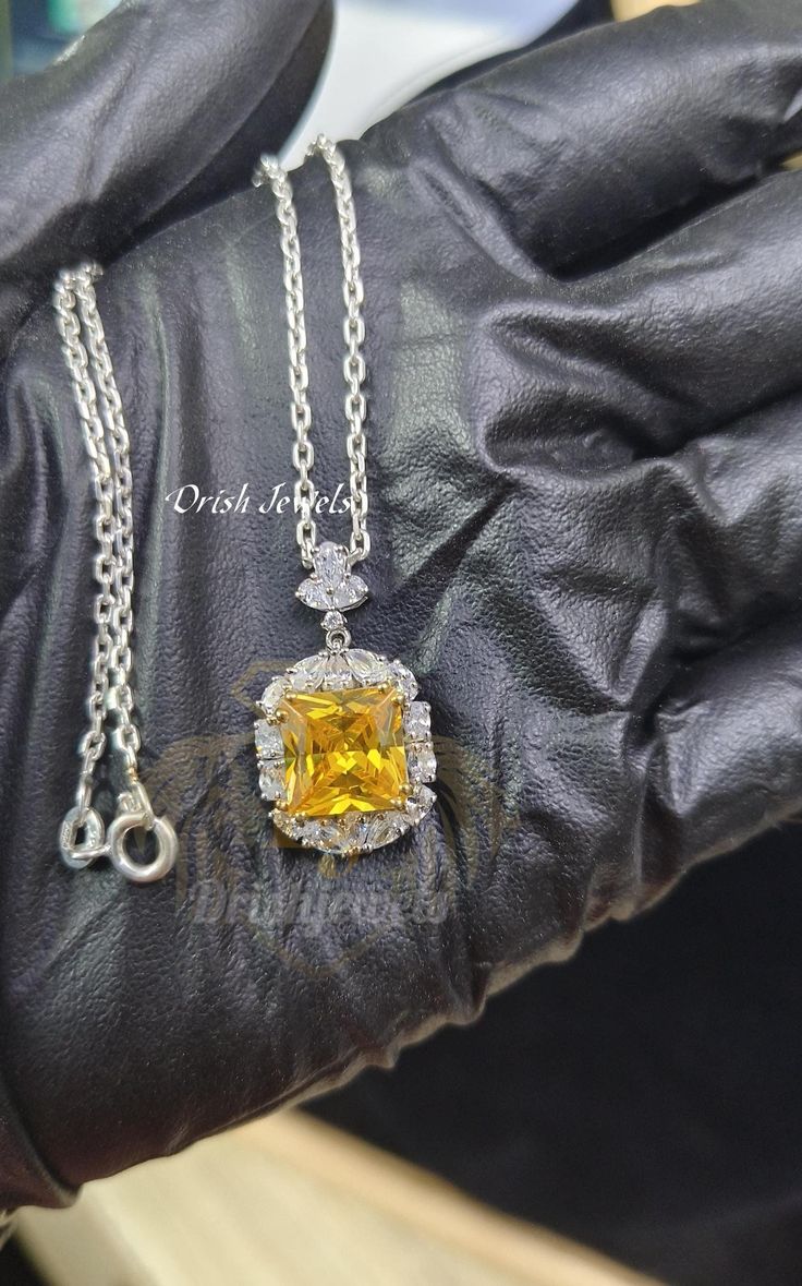 This stunning necklace features a vibrant yellow princess cut CZ diamond and delicate white round CZ floral pendant, crafted from 925 sterling silver. Perfect for gifting to your loved ones, with 1 day shipping available. 1 DAY SHIPPING ⭐ Handmade Product ⭐ Base Metal: Sterling Silver ⭐ Metal Purity: 925 parts per 1000 ⭐ Finish: 14K White Gold Plated ⭐ Main Stone Clarity: VVS1 ⭐ Main Stone Creation: Simulated ⭐ Stone Color: Yellow & White ⭐ Stone Shape: Princess ⭐ Gender: Female ⭐ Express Shippi Luxury Brilliant Cut Citrine Jewelry, Dazzling Diamond Jewelry Gift For Her, Luxury Citrine Jewelry With Diamond Accents, Diamond White Pendant Jewelry Gift, Dazzling Diamond Cut Jewelry Gift, Brilliant Cut Cubic Zirconia Jewelry Gift, Gift Jewelry With Brilliant Cut Cubic Zirconia, Cubic Zirconia Jewelry With Diamond Cut For Gift, White Gold Square Pendant Jewelry