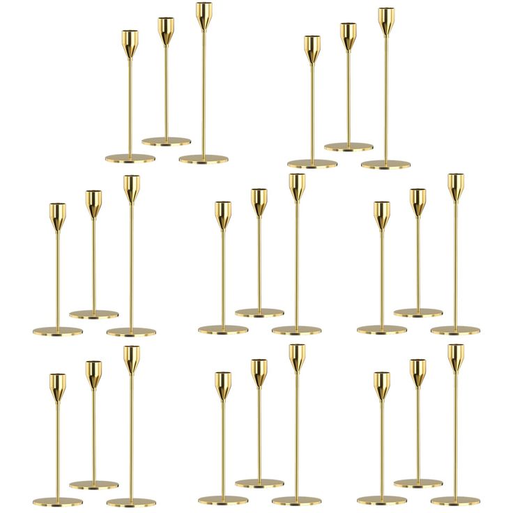 twelve brass candlesticks in different sizes and shapes, all lined up against a white background