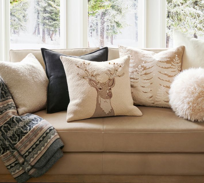 a couch with several pillows on top of it