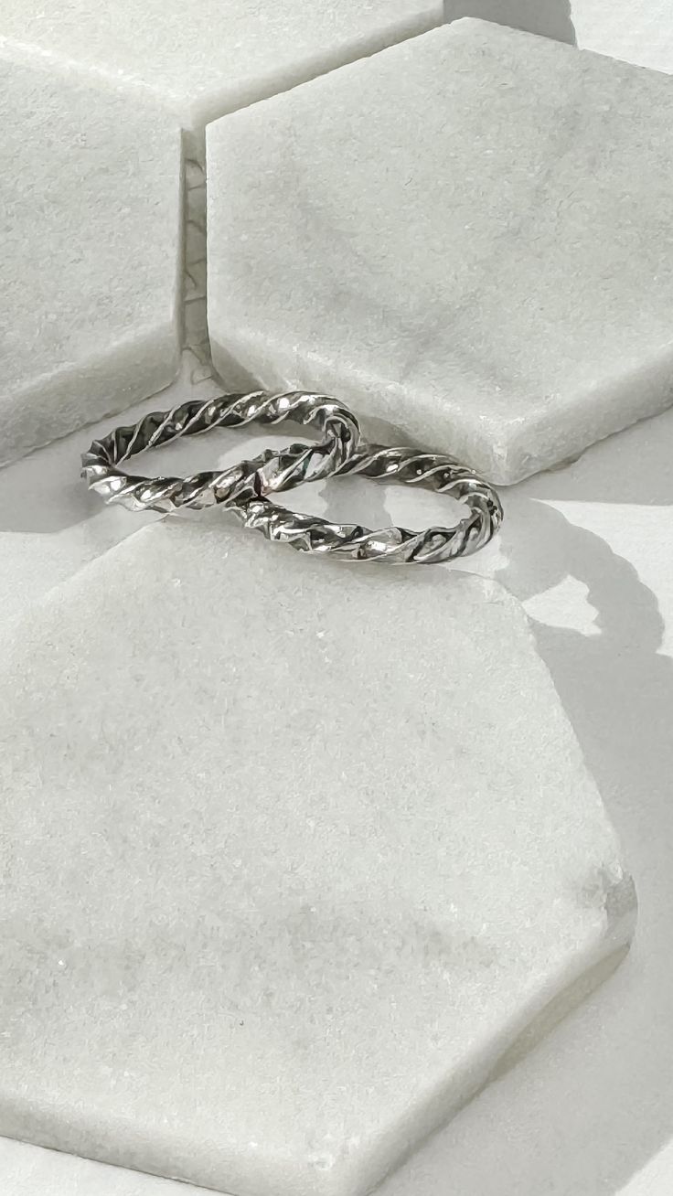 Handmade sterling silver stacking rings make a beautiful addition to any ring stack or worn alone. Stackable Twisted Rings For Promise, Modern Twist Stackable Rings For Promise, Modern Twist Stackable Twisted Promise Rings, Minimalist Stacked Midi Rings As Gift, Modern Twist Twisted Promise Ring, Modern Twisted Shape Promise Ring, Modern Twisted Promise Ring, Adjustable Stackable Midi Rings With A Modern Twist, Modern Twist Stackable Adjustable Midi Rings