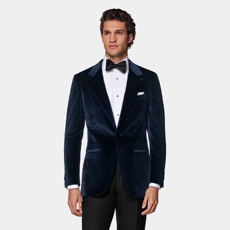 This navy dinner jacket is cut to a tailored fit, providing a slim chest and waist for a fitted silhouette and a natural shoulder design. It features a straight peak lapel, jetted pockets, and a half-canvas construction. Formal Single-breasted Sport Coat With Lapel Collar, Luxury Navy Blazer With Pressed Crease, Evening Tuxedo With Welt Pockets And Long Sleeves, Long Sleeve Evening Tuxedo With Welt Pockets, Fitted Single Breasted Blazer For Black-tie Events, Fitted Single-breasted Blazer For Black-tie Events, Semi-formal Sport Coat With Lapel Collar, Luxury Navy Blazer For Semi-formal Occasions, Luxury Navy Sport Coat For Semi-formal Occasions