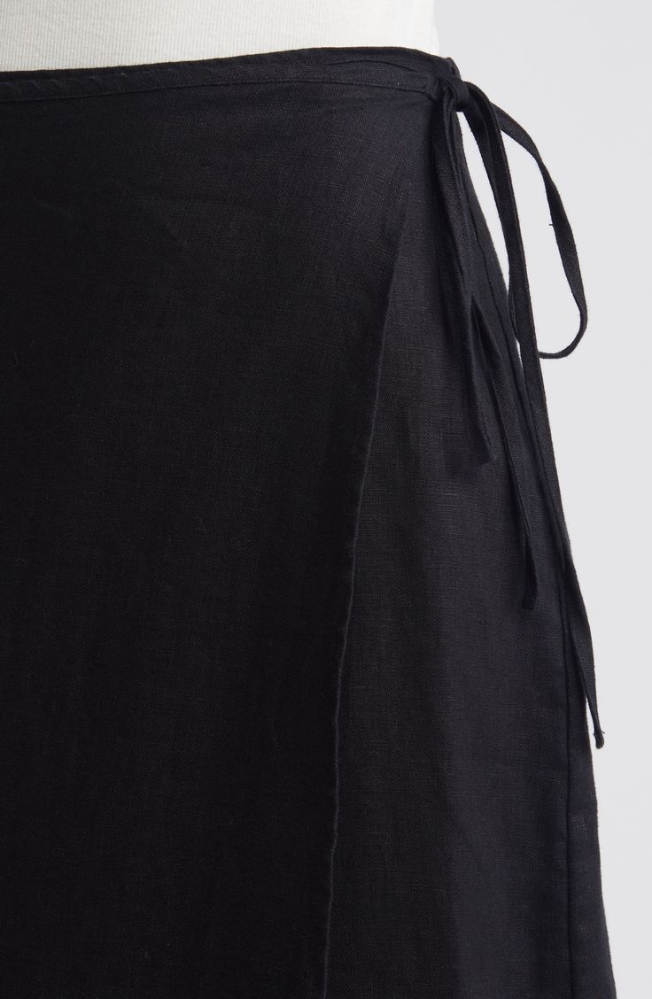 A delicate string tie secures the wrapped silhouette of a classic black midi skirt cut from breezy linen. 32 1/2" length (size Medium) True wrap style with side tie closure Unlined 100% linen Dry clean Imported Wrap Midi Skirt, Summer Wardrobe Essentials, Wrap Maxi Skirt, Wedding Guest Shoes, Sneaker Slippers, Black Midi, Black Midi Skirt, Sports Blazer, Baby Boy Shoes