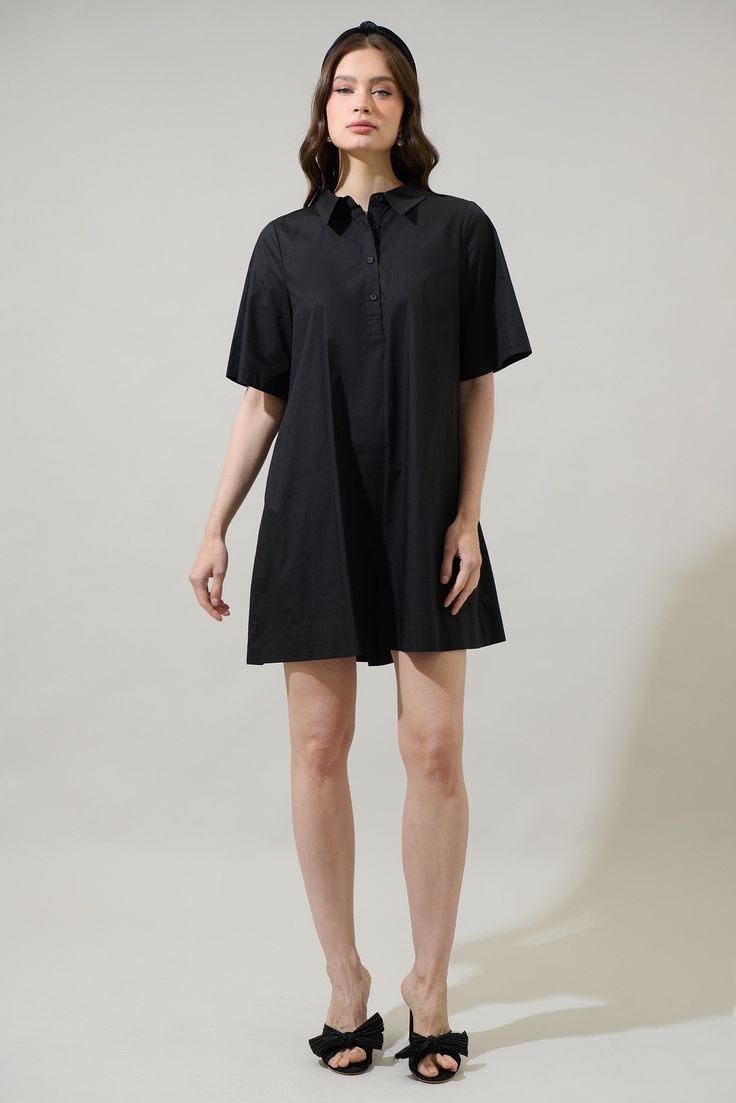 The Danbury Collared Trapeze Mini Dress will have you wanting to spend the day out. It features short sleeves and a button up front leading to a collared neck. The back has an inverted pleat design. It can be easily paired up with sandals or strappy heels. - Pockets- Flutter sleeves- Button up- Boxy fit- Comes in 2 colorsSize + Fit - Model is 5'8" and wearing size XS- Measurements taken from size S - Chest: 19 1/2"- Length: 34 1/2" Fabric Self: 100% Cotton Style Number STD14556 Short Sleeve Shirt Dress With Button Closure For Summer, Short Sleeve Cotton Dress For Work, Classic Pleated Short Sleeve Shirt Dress, Classic Pleated Shirt Dress With Short Sleeves, Relaxed Fit Short Sleeve Dress, Classic Black Shirt Dress With Short Sleeves, Black Relaxed Fit Shirt Dress With Short Sleeves, Short Sleeve Shirt Dress With Buttons For Work, Short Sleeve Workwear Dresses With Placket