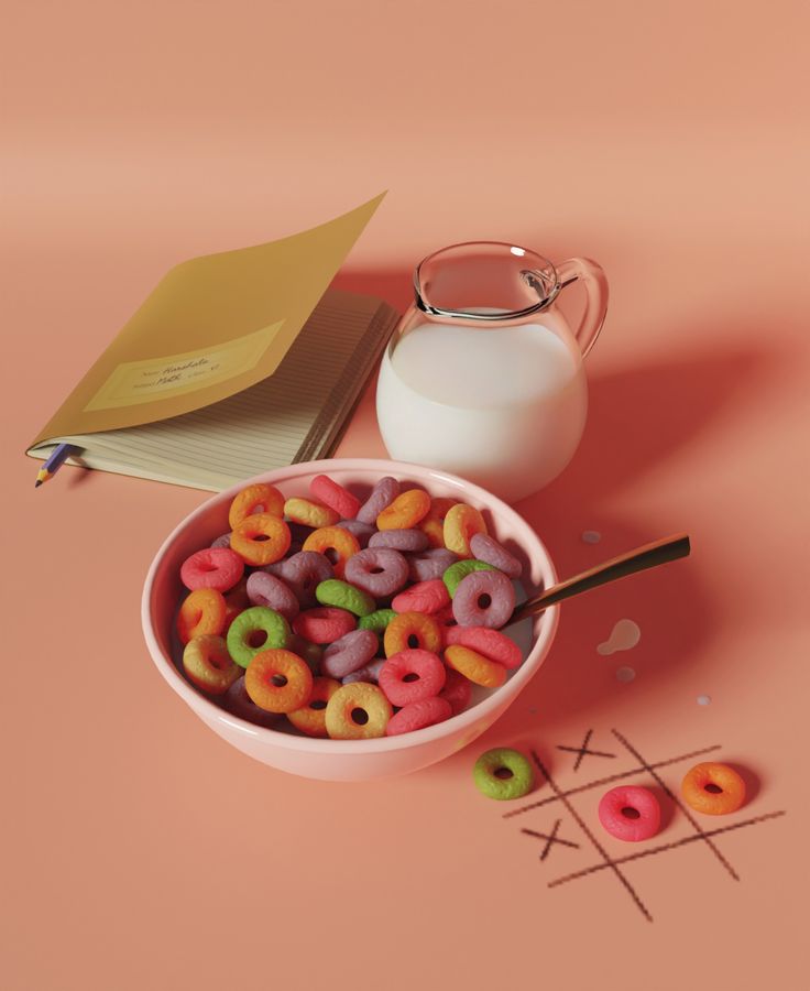 a pink bowl filled with cereal next to a glass of milk and a notepad