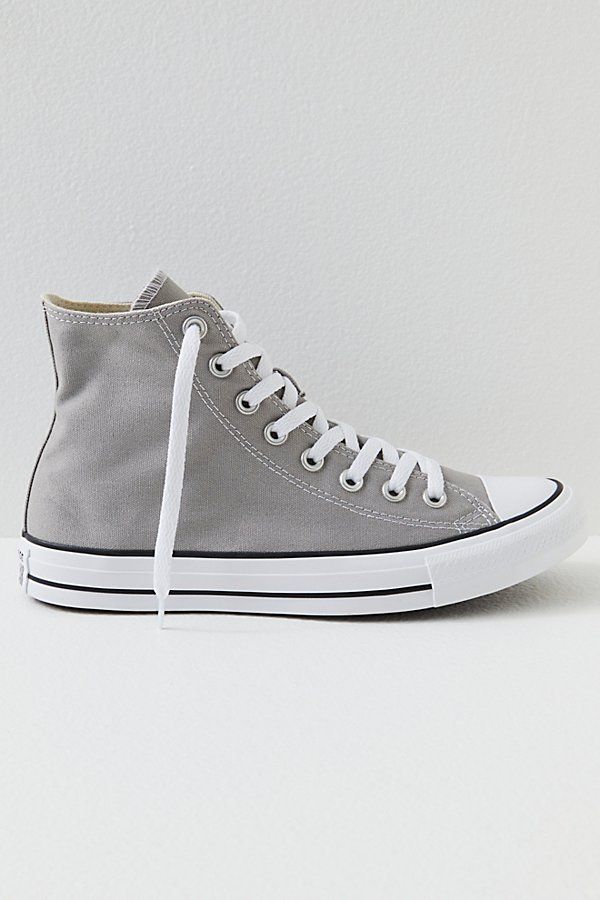 **Fit:** This style is in unisex sizing so a men's size 4 is a women’s size 6. Classic canvas high top Chuck Taylors. | Chuck Taylor All Star Hi Top Converse Sneakers at Free People in Grey, Size: US 5 M Gray High-top Canvas Shoes, Gray High-top Canvas Shoes With Rubber Sole, Gray High-top Canvas Shoes With Vulcanized Sole, Gray High-top Casual Canvas Shoes, Sporty Gray High-top Canvas Sneakers, Sporty Gray High-top Sneakers, Urban High-top Cotton Canvas Shoes, Casual Gray High-top Canvas Shoes, Gray High-top Canvas Sneakers