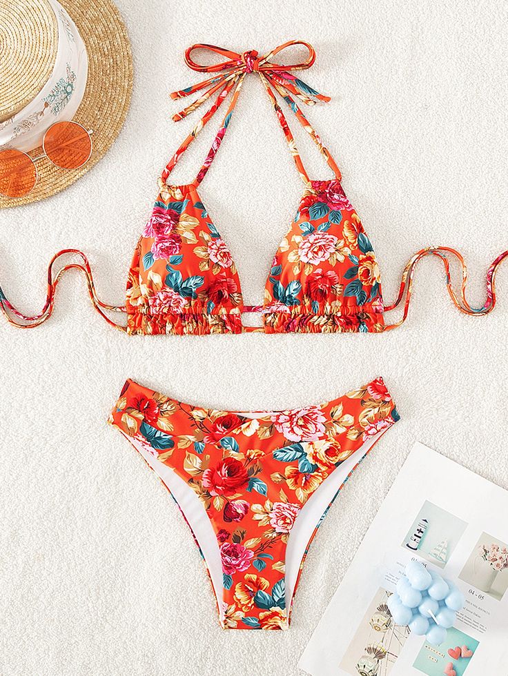 Flaunt your curves and embrace retro vibes with the Illyria High Waist Bikini Set. Featuring a playful floral pattern and a trendy tie element, this set will have you turning heads at the beach. The halter strap adds extra support and the polyester material provides comfort all day long. Dive into style with this bikini set! Specs: Material: Polyester Summer Printed Halter Neck Swimwear, Floral Print Halter Neck Swimwear For Sunbathing, Floral Print Halter Neck Swimwear For Beach Season, Floral Print Halter Neck Swimwear For Summer, Beachy Halter Neck Swimwear With Floral Print, Floral Print Halter Neck Tankini For Swimming, Summer Floral Print Halter Neck Swimwear, Floral Print Halter Neck Tankini For Beach, Halter Neck Tankini With Floral Print For Poolside