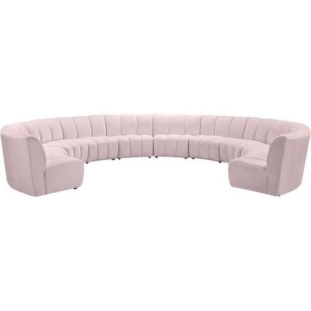 the curved sectional sofa is shown in light pink