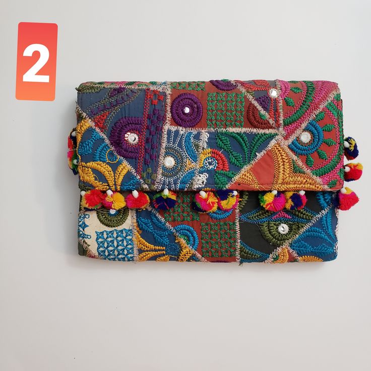 Beautiful clutch bag with vibrant colors , hand embroidery rajaathani culture bag from india  It has one secret pocket inside and zip closure . Its different color variations and style wil go with any dress color and will surely make eyes turn. Width- 17inch  Height 12 inch approximately Festive Multicolor Embroidered Handwork Clutch, Traditional Embroidered Clutch For Festivals, Rectangular Embroidered Multicolor Clutch, Traditional Multicolor Embroidered Pouch Clutch, Multicolor Embroidered Rectangular Clutch For Festivals, Rectangular Multicolor Embroidered Clutch For Festivals, Embroidered Rectangular Clutch For Festivals, Rectangular Clutch With Multicolor Embroidery For Festivals, Multicolor Embroidered Festival Clutch